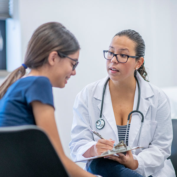 young woman visits her female doctor