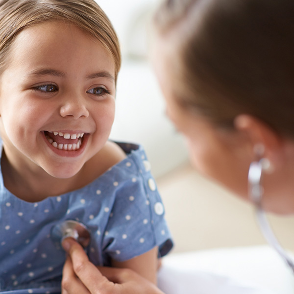 adorable young girl with her pediatrician
